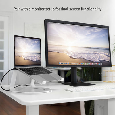 The Twelve South Curve Stand for MacBook with a MacBook Pro connected to a large screen showing the laptop as same level of the screen